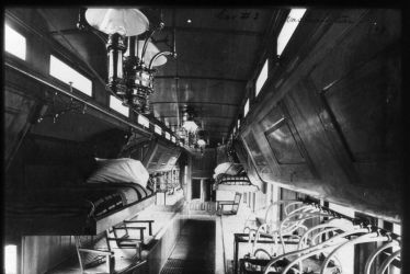 Inside one of the U.S. Fish Commission's fish cars--specially designed railroad cars in which fish and their attendants could travel around the country.National Archives FFB-384