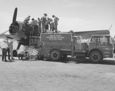 Loading a plane with fish for stocking in Lake Powell.Photo by Rex Gary Schmidt. Courtesy of National Conservation Training Center. #4572