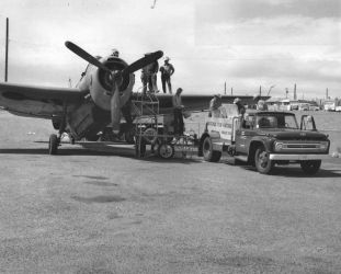 Putting fingerling trout in a plane for stocking in Lake PowellPhoto by Rex Gary Schmidt. Courtesy of National Conservation Training Center. #4577