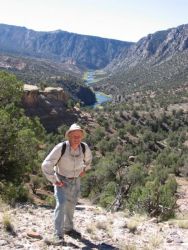 Barry Nehring, a Colorado Division of Wildlife biologist, stands in front of the Gunnison Gorge, where whirling disease nearly wiped out a legendary rainbow trout fishery.Photo by Anders Halverson
